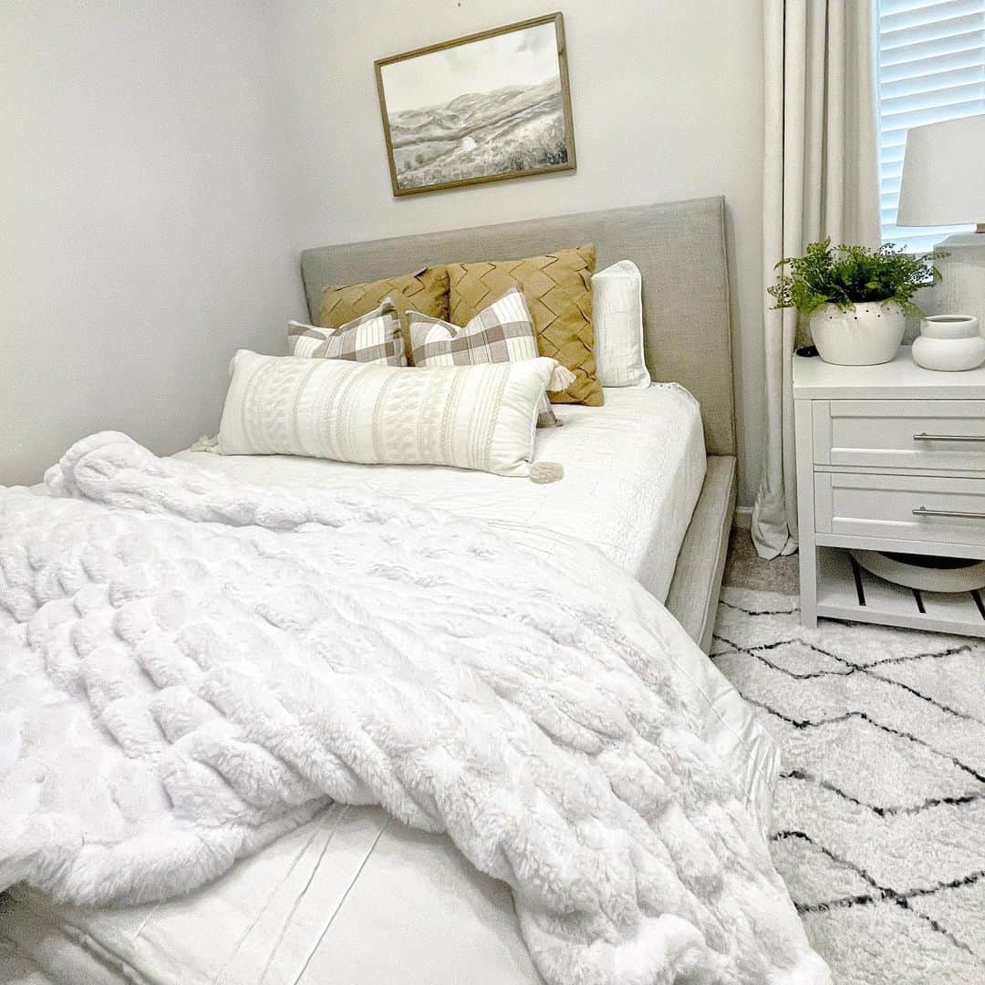 Cozy Guest Bedroom Enhanced by Soft Throw Blankets