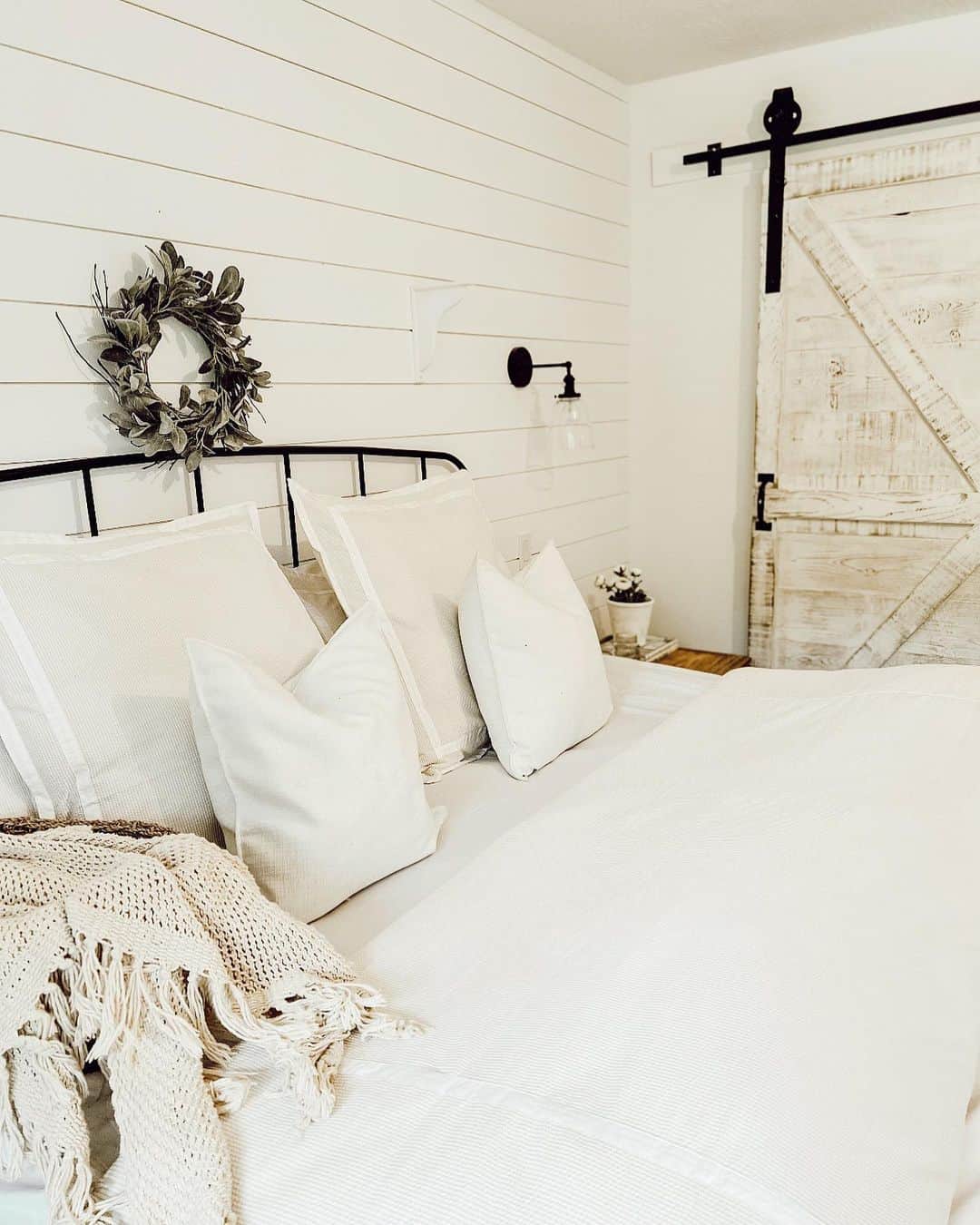 Farmhouse Bedroom Featuring Shiplap Accent Wall