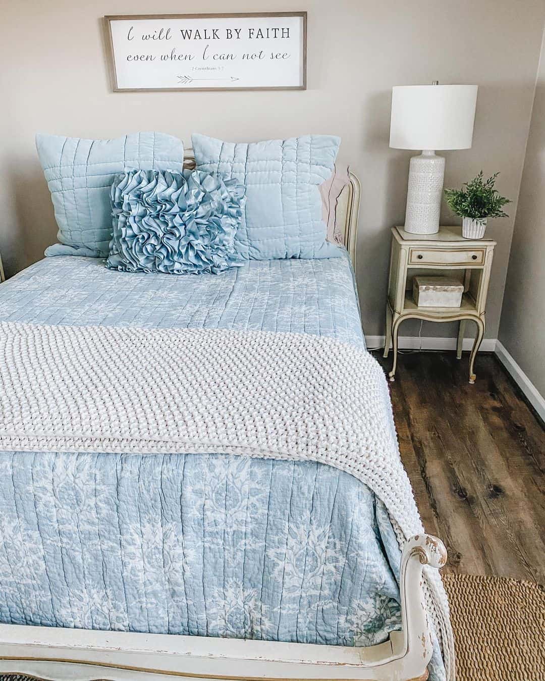 Simplistic Farmhouse Guest Room Highlighted by a Blue Bed