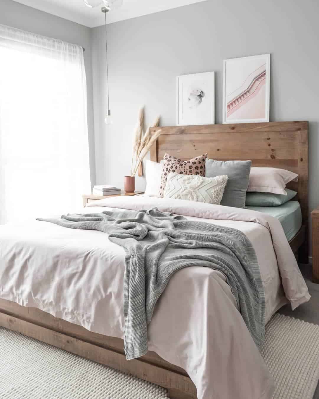 Illuminating the Cozy Master Bedroom with a Wooden Frame Bed