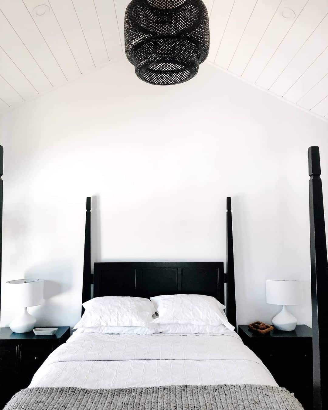 Sleek Monochrome Bedroom with Rattan Elegance