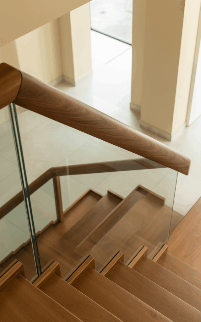 Install a glass insert beneath a wooden handrail