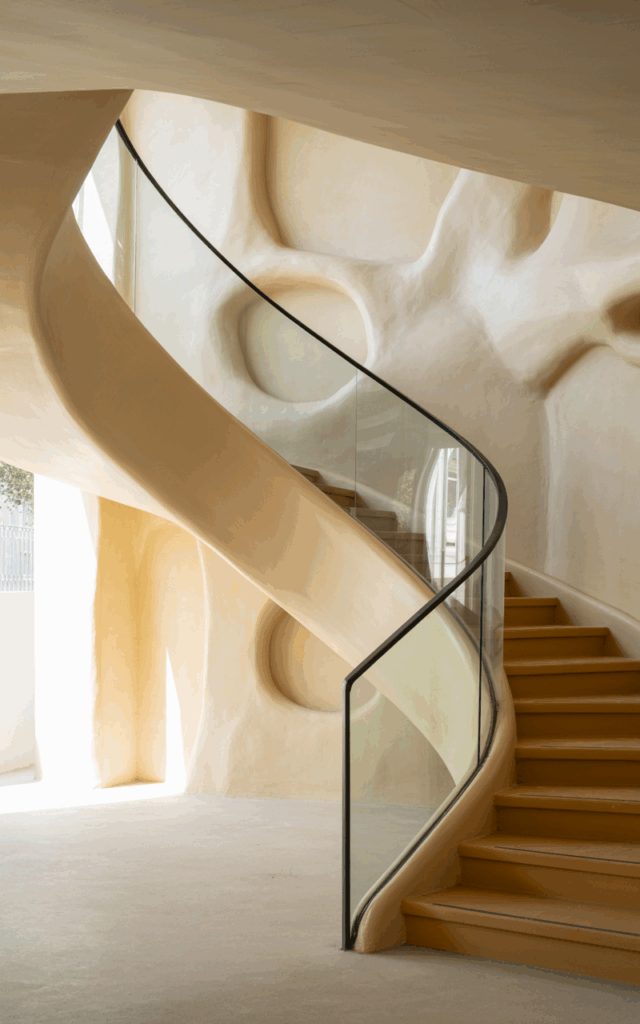 Curve the staircase gently along a feature wall
