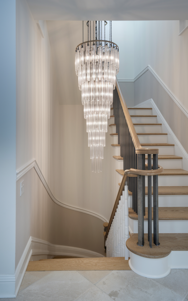 Install a statement chandelier above the staircase