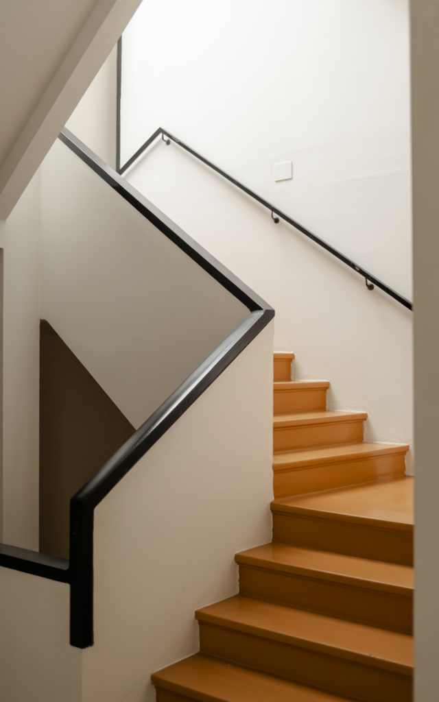 Install brass or matte black statement handrails