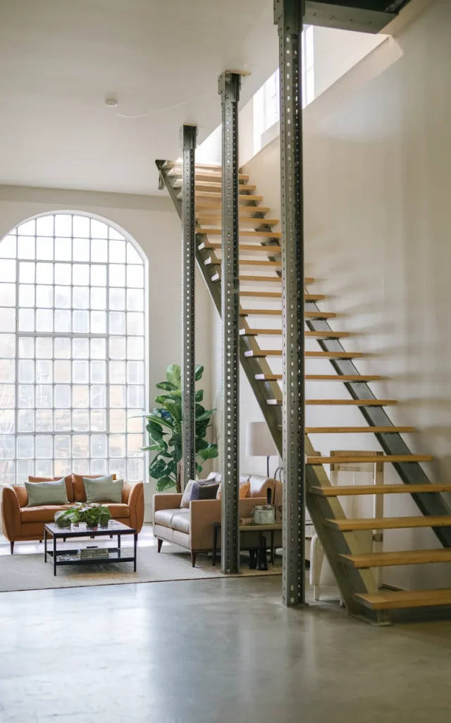 Anchor the staircase with thick industrial steel stringers