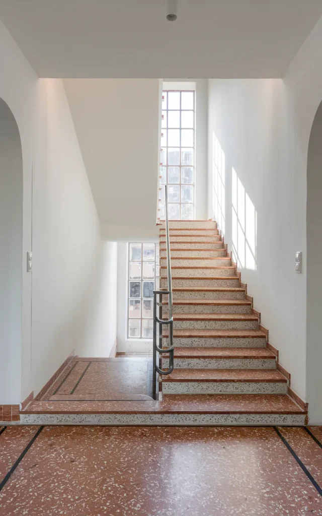 Blend staircase tiles into the hallway flooring