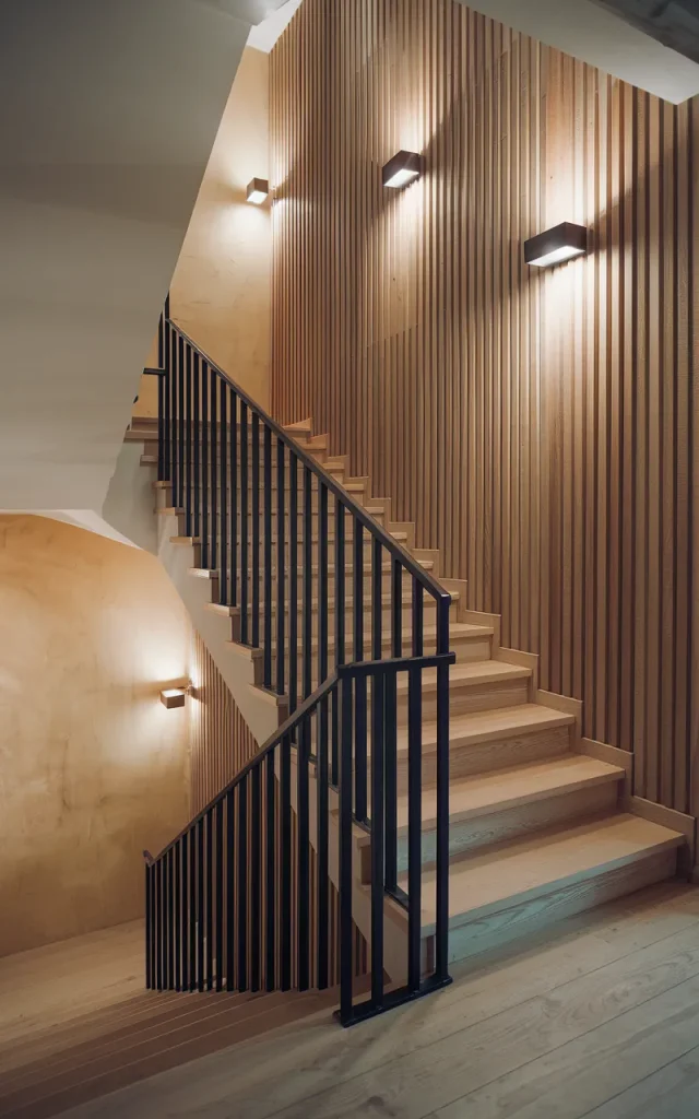 Combine black railing with wood wall slats