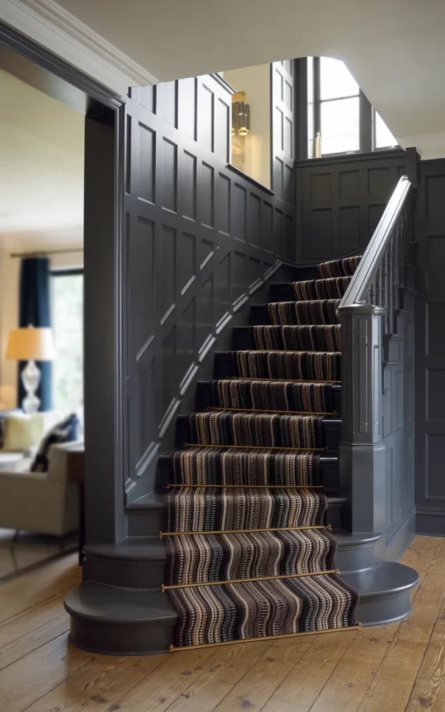 Combine paneling with a stair runner for layered texture