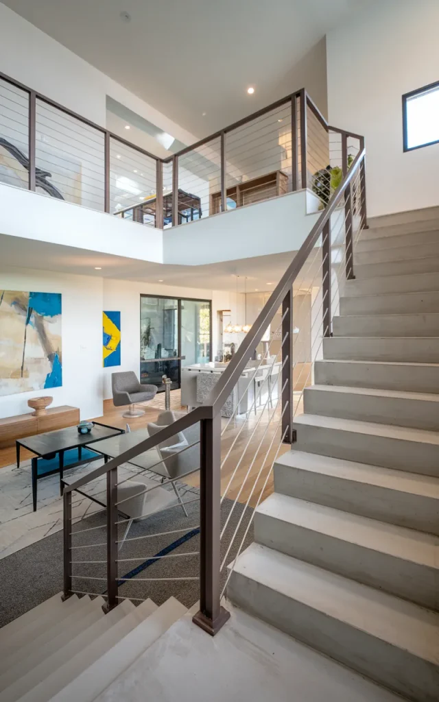 Extend the railing into a mezzanine guardrail