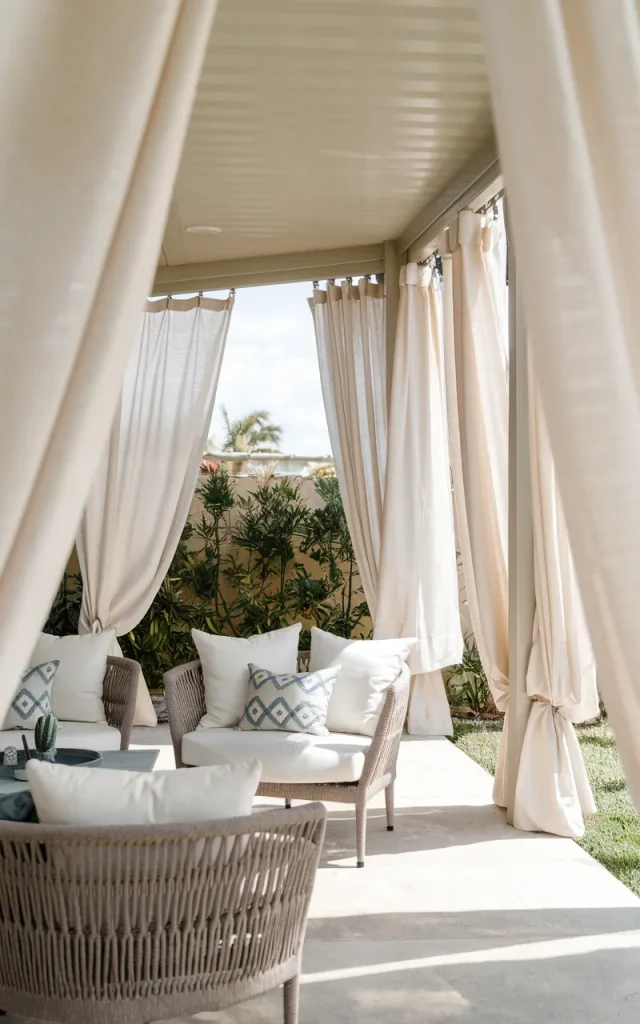 Hang outdoor curtains for a softer look.