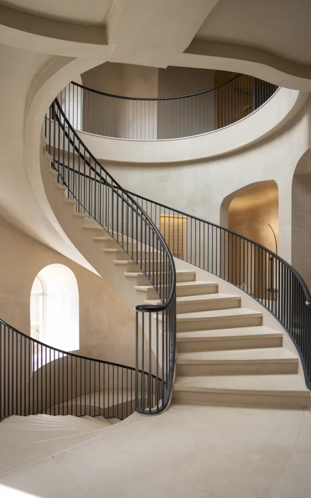 Install a curved metal railing for sculptural appeal