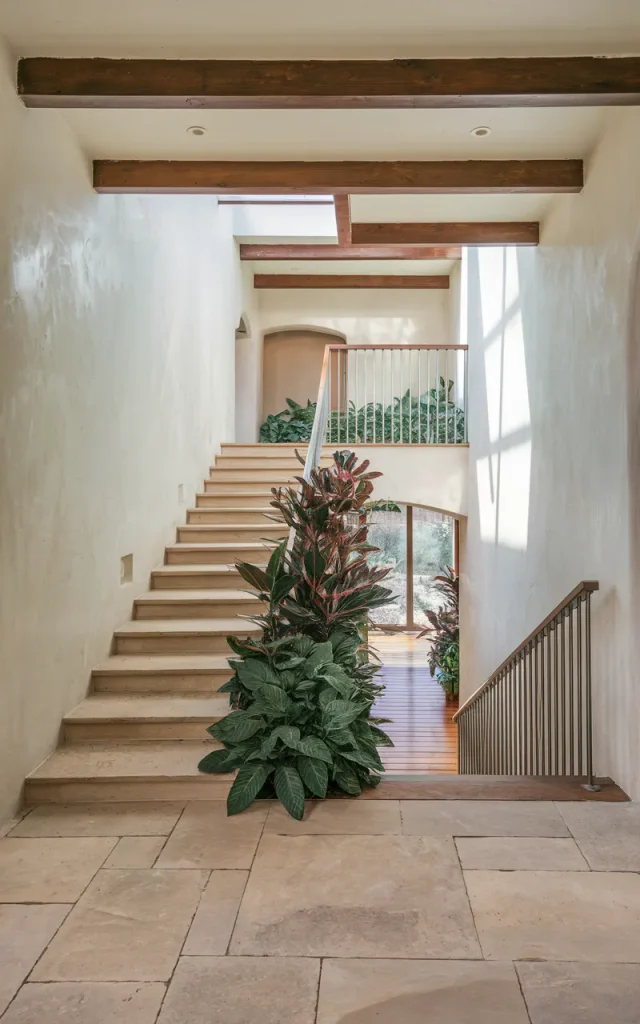 Integrate greenery along the staircase edge