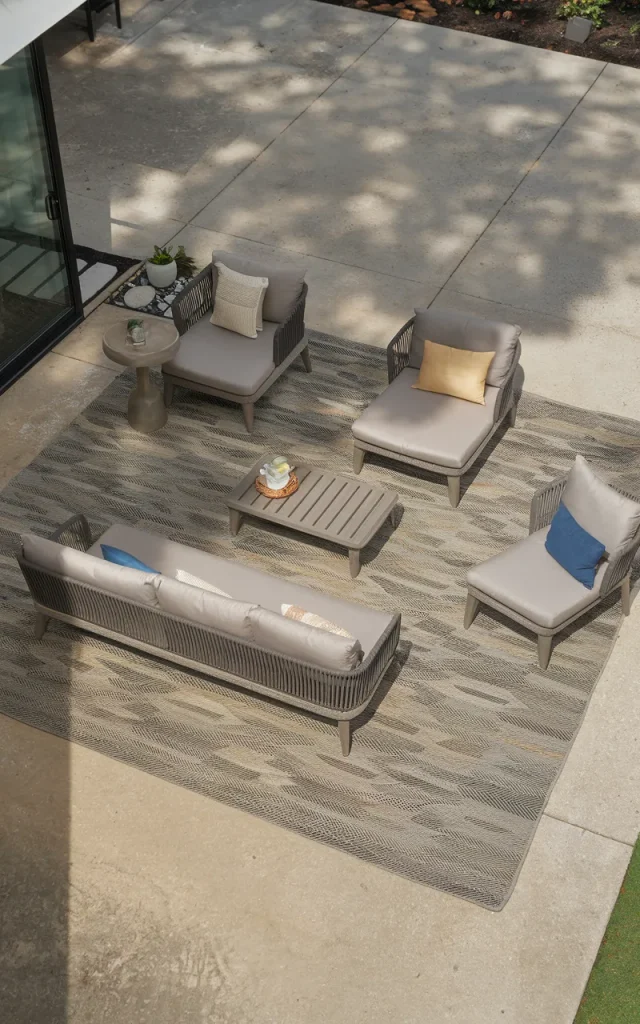 Layer an outdoor rug over the concrete.